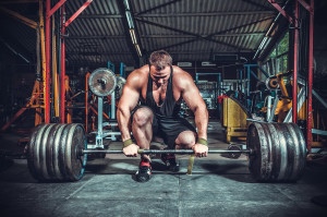 Powerlifter with strong arms lifting weights