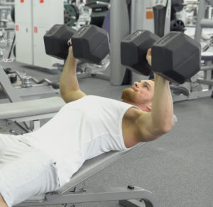 dumbbell bench press with mixed rep workouts builds chest muscles